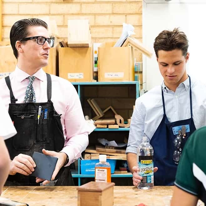 Student and teacher woodworking