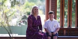 Eileen and Leo sitting in a school