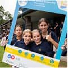 Kids taking a photo with a novelty frame