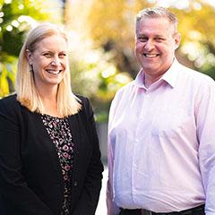 Two teachers smiling