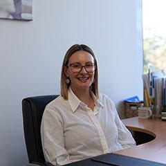 School secretary smiling
